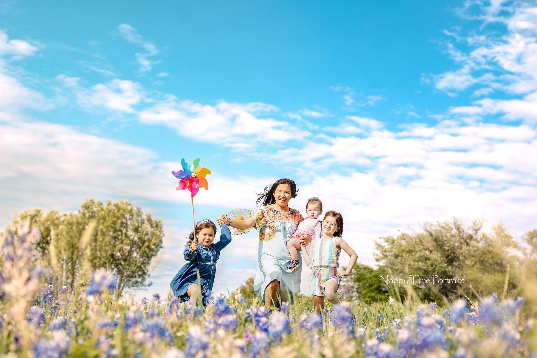 Family portrait in bluebonnets by Nappy Time Portraits