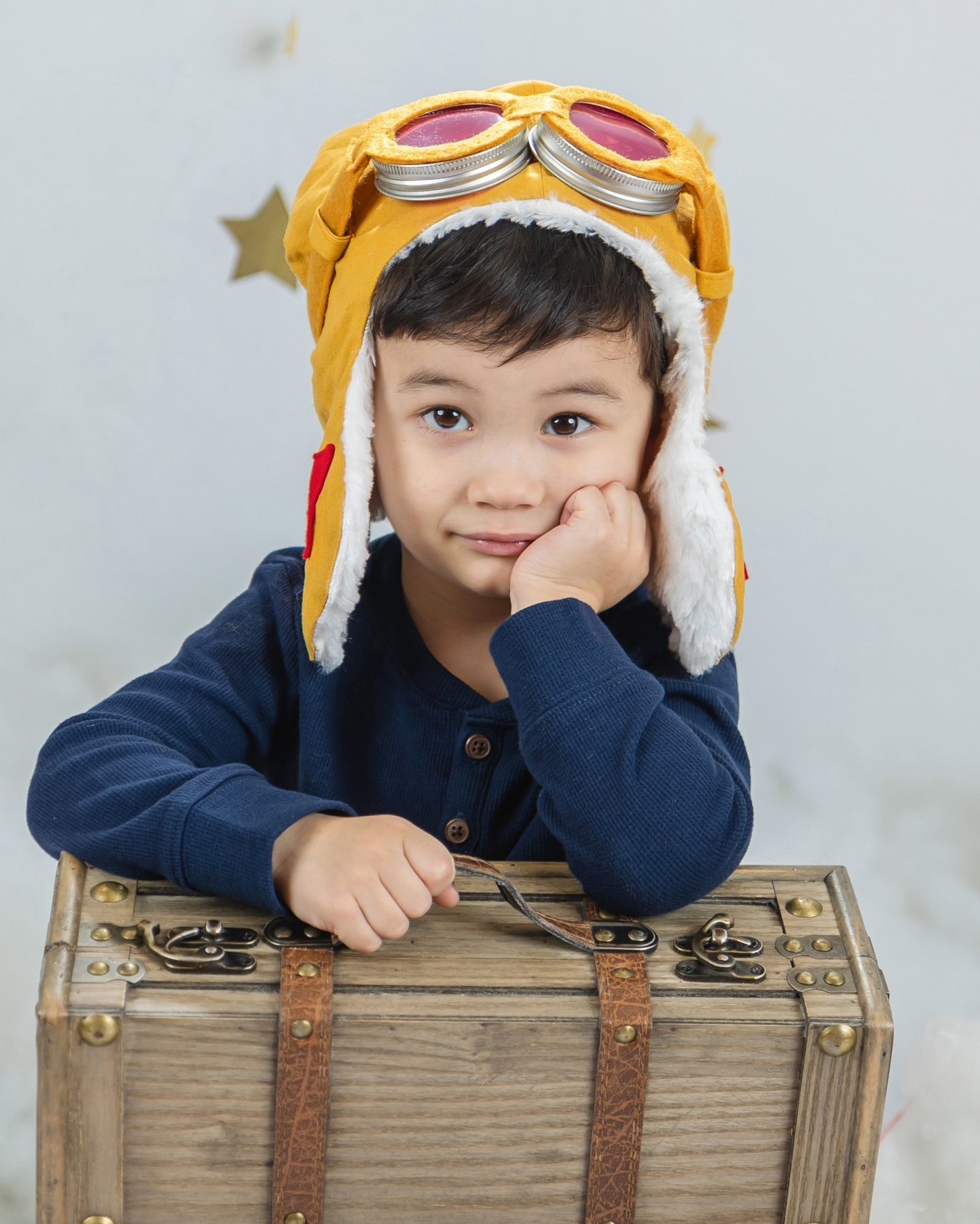 Young child photographed in a creative school portrait by Lil' Angels Photography Austin